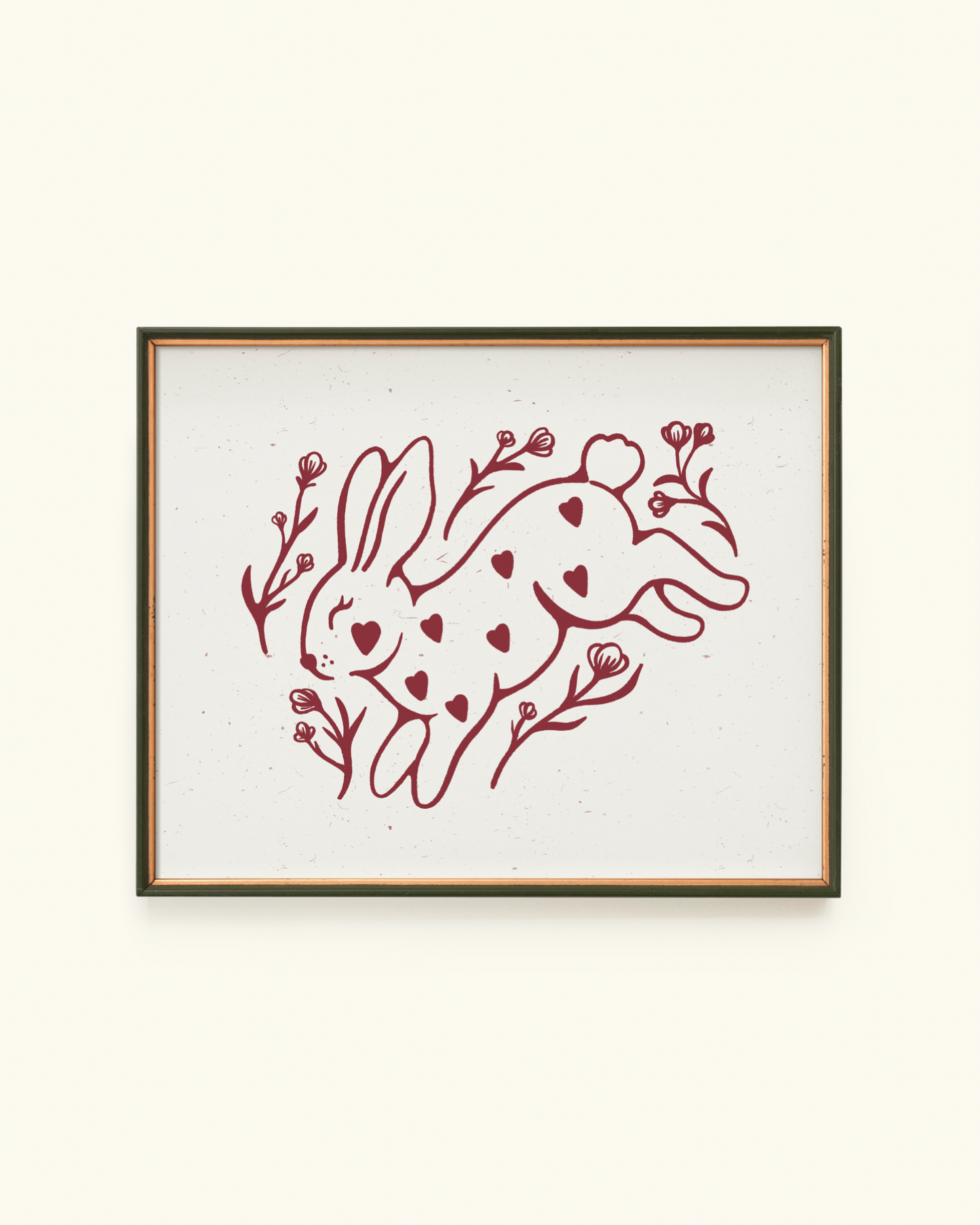 Framed artwork with a red rabbit design on a white background